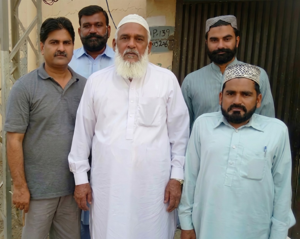 Syed Ejaz Gillani with community members