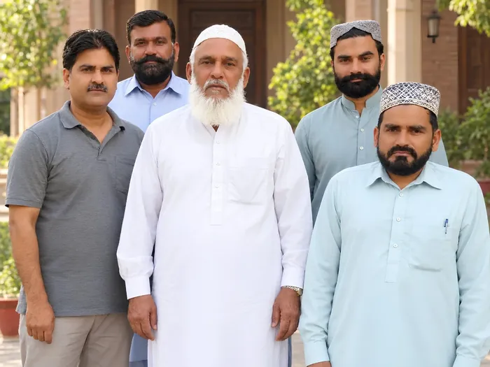 Syed Ejaz Gillani with community members at cultural literary gathering